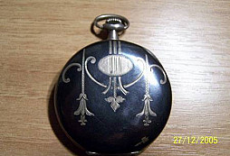 Hodinky, odznak a medaila