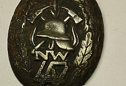 Zřejmě hasičský odznak 